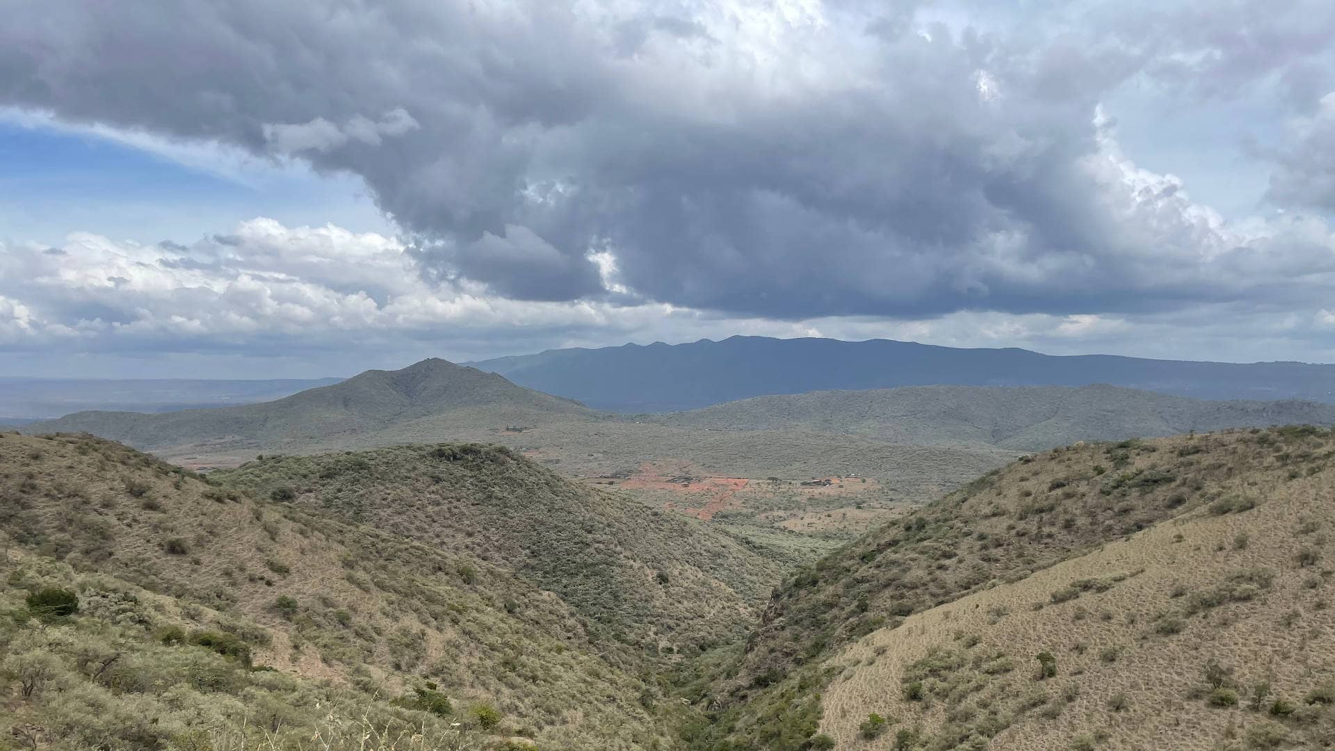 Expansive Elemtata valley under dramatic Kenyan skies